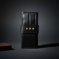 Black roll-up leather wallet with eight shear spaces