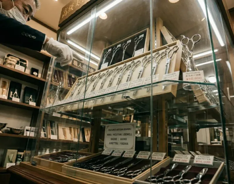 Scissor sets in a glass display cabinet