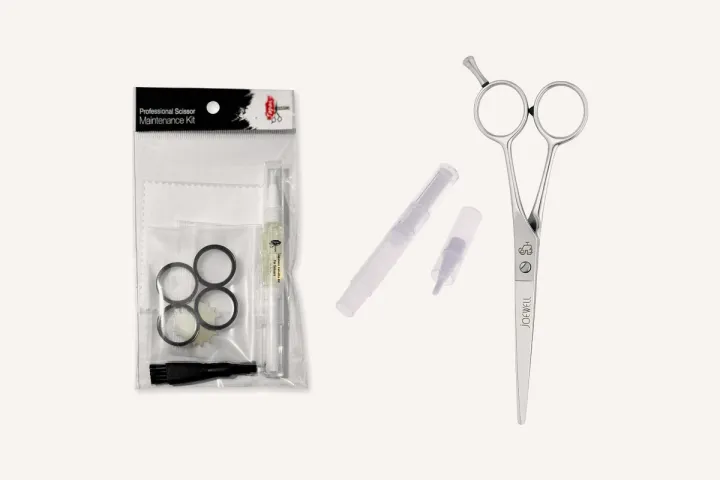 A scissor maintenance kit, a scissor oil pen and a Joewell Classic cutting scissor.