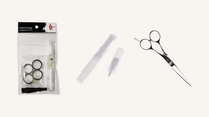 A scissor maintenance kit and an oil pen beside a Yasaka SA Classic cutting scissor.