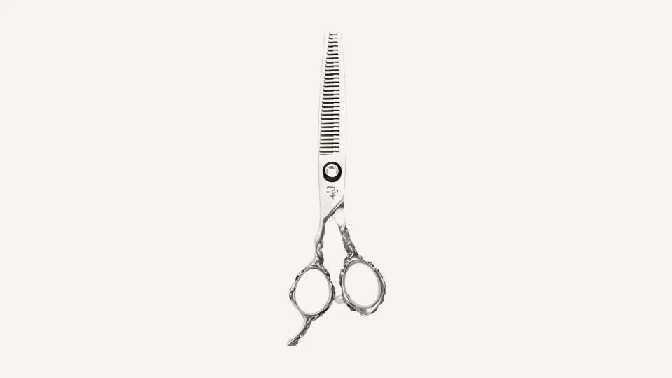 Ichiro Rose Lefty thinning scissor with a toothed blade and engraved handles.