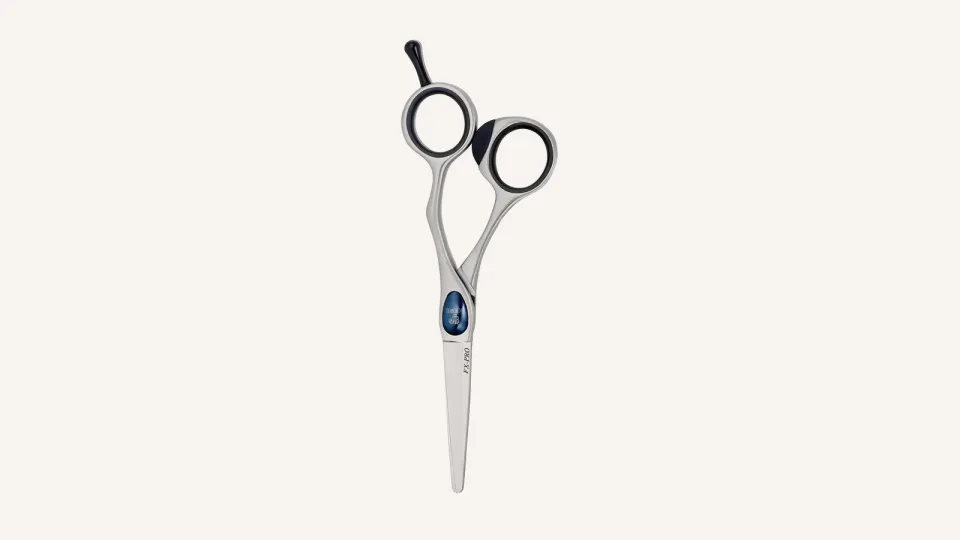 Joewell FX PRO catalogue photo: an offset cutting scissor with a blue pivot cover and FX-PRO engraved on the blade.